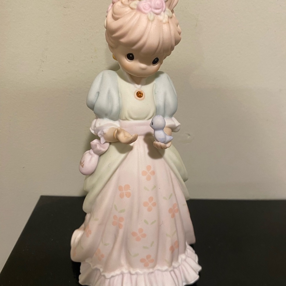 Charming Figurine with Floral Dress and Bird